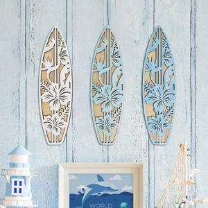 Three surfboard wooden wall plaques with floral carvings for coastal home decor