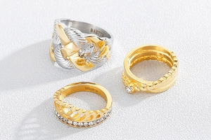 Detailed view of vintage gold rings and bicolor steel rings with crystal accents