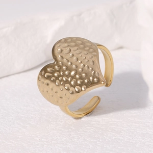 Minimalist gold hammered heart ring with textured finish and adjustable open band