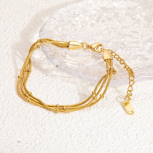 Layered 18K gold-plated stainless steel snake chain bracelet with elegant beads