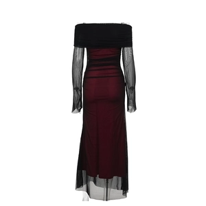 Detail of off-shoulder wine red dress with sheer black mesh sleeves on white background