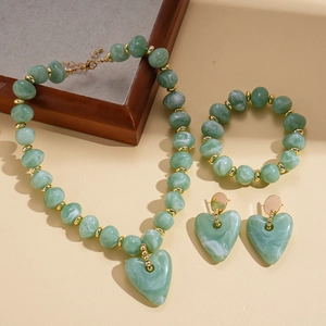 Detailed set of green marble acrylic heart pendants with gold accents and beaded chain