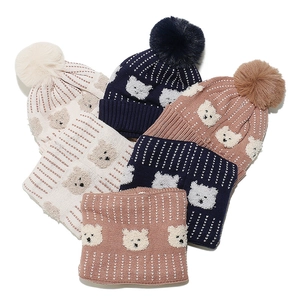Winter knit hat and scarf set for kids featuring bear patterns and fluffy pom-poms