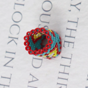 Handwoven Miyuki evil eye beaded ring with colorful geometric folk pattern