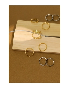 Detail of minimalist S925 sterling silver beaded rings in gold and silver finishes