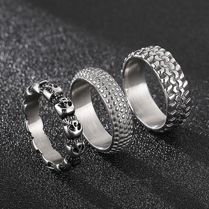 Set of three punk style skull and tire pattern silver stainless steel rings for men