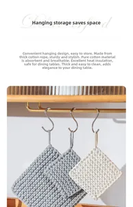 Detail of hand-woven cotton heat-resistant square coasters with convenient hanging loops