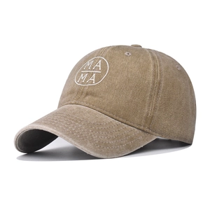 Detailed close-up of khaki washed cotton baseball cap with white MAMA embroidery