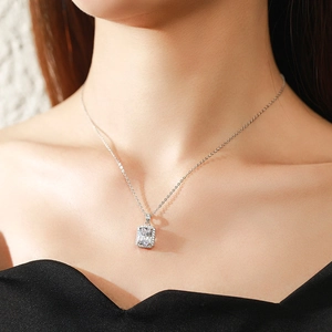 Elegant 925 sterling silver necklace with rectangular zircon pendant worn by a model