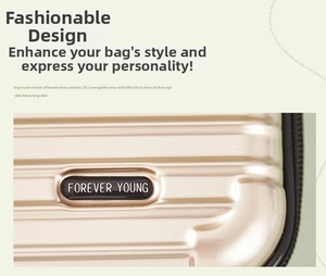 Close-up of champagne gold hard shell bag featuring the Forever Young metal logo