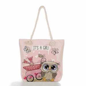 Detail of pink canvas tote bag with hemp handles and owl It's a girl print pattern