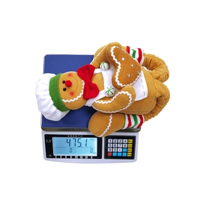 Detailed scale measurement showing the 475g weight of this plush gingerbread elf toy