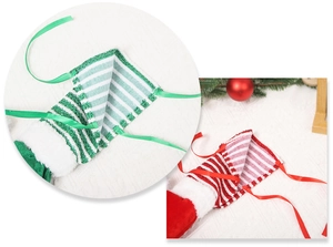 Close-up of Christmas elf leg covers with red and green stripes and white plush trim