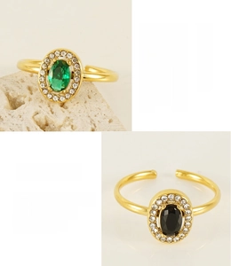Detail of 18K gold plated stainless steel adjustable rings with green and black stones