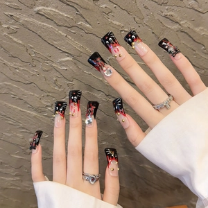 Handmade coffin press-on nails with black cat eye design and 3D rhinestone decorations
