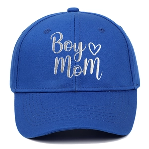 Close-up of Boy Mom white embroidery and stitching on royal blue cotton baseball cap