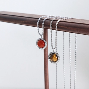 Snake chain necklaces with round red stone and tiger eye pendants in stainless steel