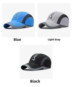 Detailed view of quick-dry sports baseball caps in blue, light grey, and black colors