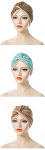 Detail of the twisted front knot on a three-color knit turban hat for women