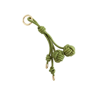 Handmade green braided nylon bag charm with golden metal rings and knots for women accessories
