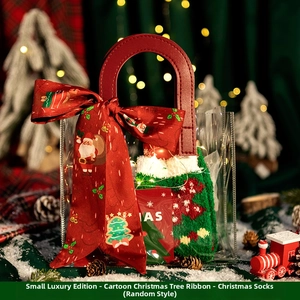 Close-up of Christmas gift set with PVC tote bag, festive silk scarf, and coral fleece socks
