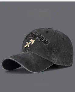 Detailed view of Sagittarius embroidery on grey washed vintage cotton baseball cap