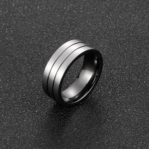 Macro shot of gunmetal titanium ring with double grooves and brushed matte finish
