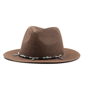 Dark brown straw fedora beach hat with bohemian beaded band and metal feather charm