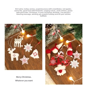 Close-up of reindeer, snowflake, and bell felt ornaments in red and white colors