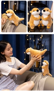 Detail of cute groundhog plush toys in sitting and standing poses on a cozy sofa