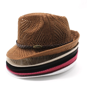 Stacked collection of knitted fedora hats in brown, beige, black, pink and white colors