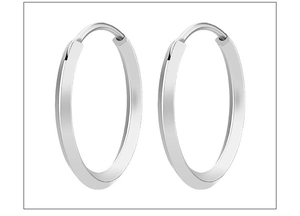 Close-up of polished silver titanium steel geometric earrings with high shine finish