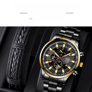 Detailed view of quartz calendar watch with black leather bracelet on a display stand