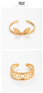 Close-up of golden bunny ear and open chain pattern stainless steel rings for women