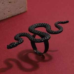 Macro detail of gothic matte black snake ring featuring intricate scale textures and coils