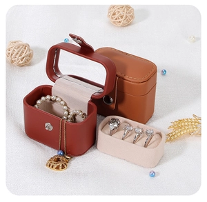 Detail view of open PU leather jewelry box with mirror and portable travel storage cases