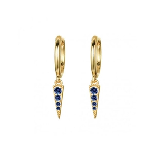 Detail view of golden geometric earrings with blue crystals in a triangular shape