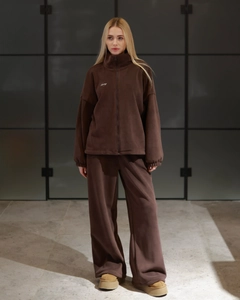 Detail of dark brown fleece loungewear set featuring letter embroidery and zip cardigan