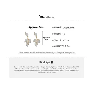 Detailed size chart showing leaf drop earrings made of copper and cubic zirconia