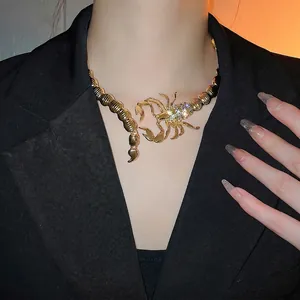 Exaggerated golden scorpion choker necklace with rhinestones for a bold statement look