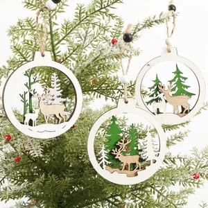 Three hollow wooden Christmas tree ornaments featuring reindeer and pine forest scenes