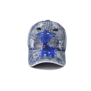Detail of washed denim baseball cap featuring cartoon sheep graffiti and distressed holes