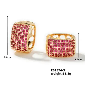 Detailed view of gold square earrings with magenta zircons and 2.0cm dimension