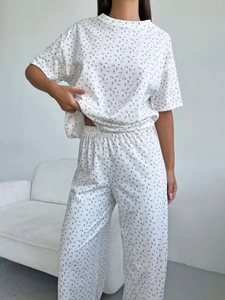 Close-up of heart floral pattern on soft cotton two-piece pajama set with pants