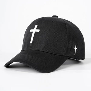 Classic black cotton baseball cap with white cross embroidery in a 45-degree side view