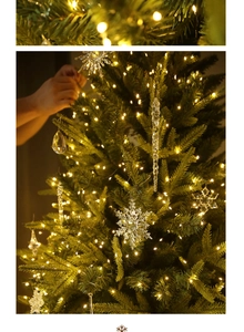 Close-up of clear acrylic snowflake and icicle ornaments on a glowing Christmas tree