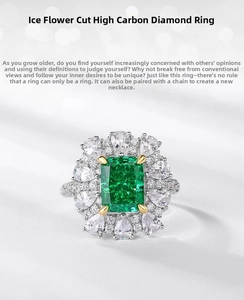 Macro detail of emerald-cut high carbon diamond ring with flower-shaped halo design