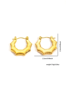 Detailed view of golden irregular geometric hoop earrings with hammered texture and dimensions