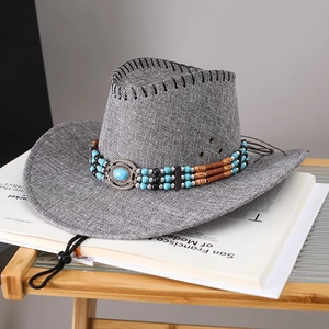 Close-up of grey woven sun hat with bohemian turquoise bead band and wind cord