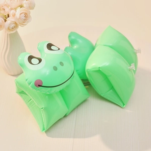 Detailed view of green inflatable swim arm bands with 3D frog design and safety valves